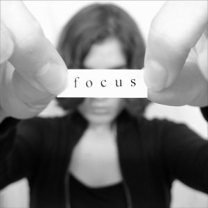 Girl holding focus sign