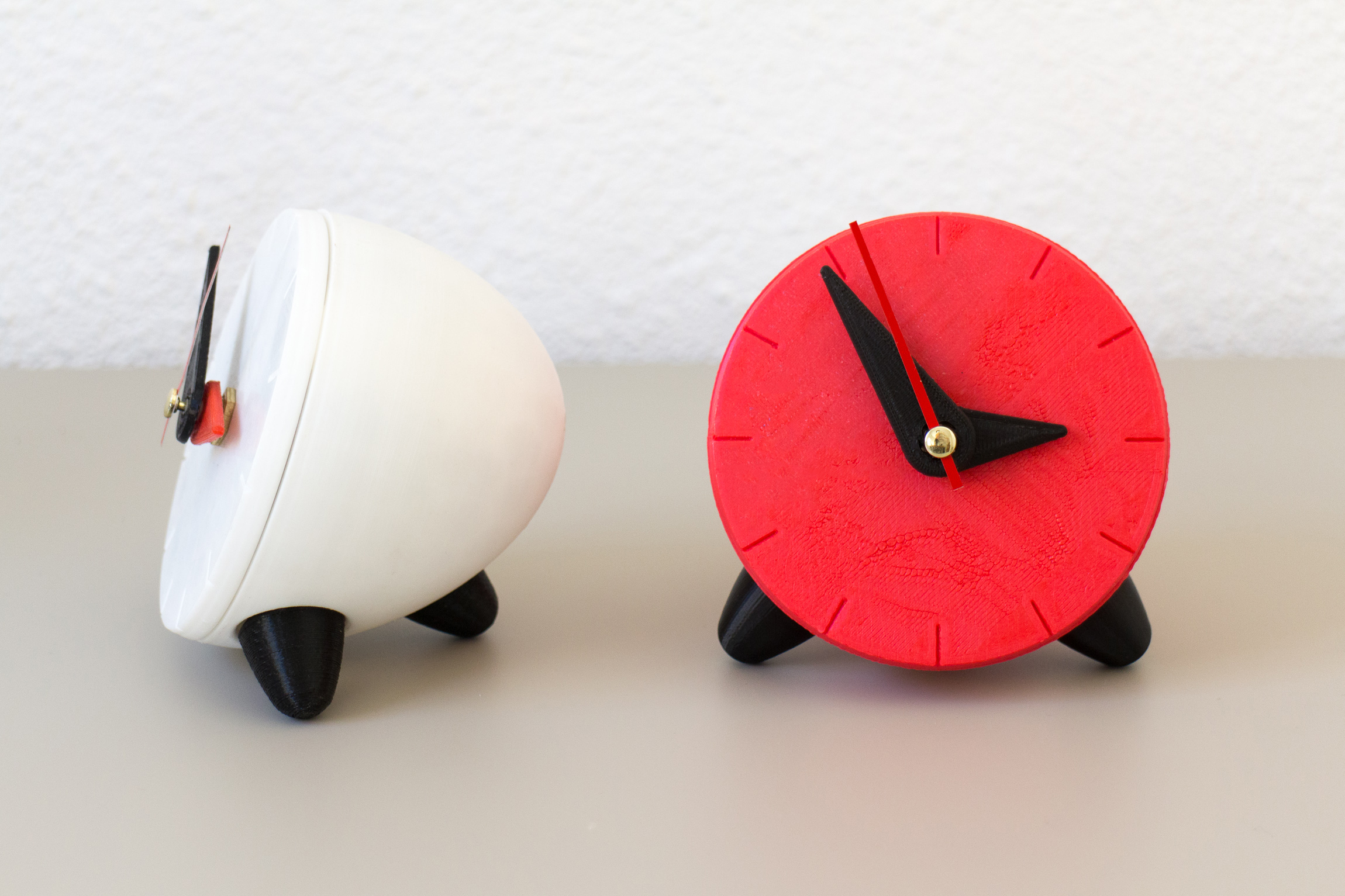 Red and white 3D printed clocks